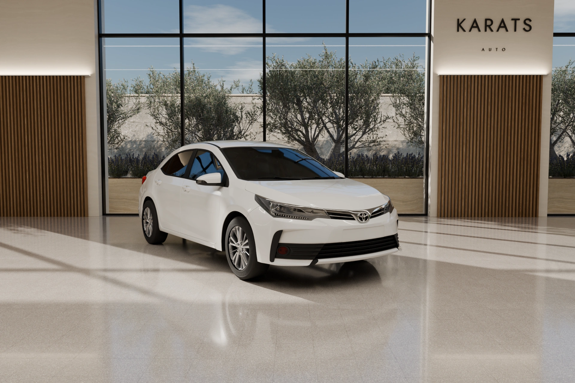 Toyota Corolla blanco en el showroom de KARATS AUTO